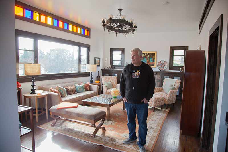 Paul Downer in his home on Meridian Street. (Photo credit: Rafael Cardenas)